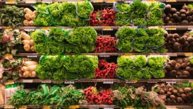 Close-up view of a produce section in a grocery store, showcasing the variety of fresh vegetables available to those facing food insecurity.