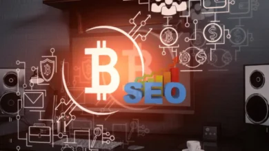 A digital workspace with a computer monitor displaying a Bitcoin symbol and the word "SEO," surrounded by marketing and blockchain icons.