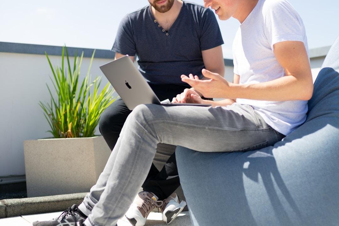 Two professionals working with online fax services, illustrating the shift from traditional faxing methods.