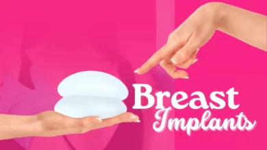 A hand points to two different types of breast implants, showcasing the variety in shape, size, and texture for augmentation.